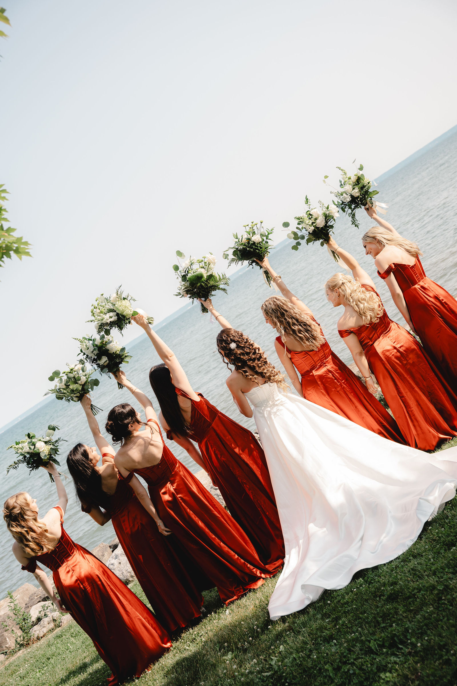 Bouquets raised high by the lake
