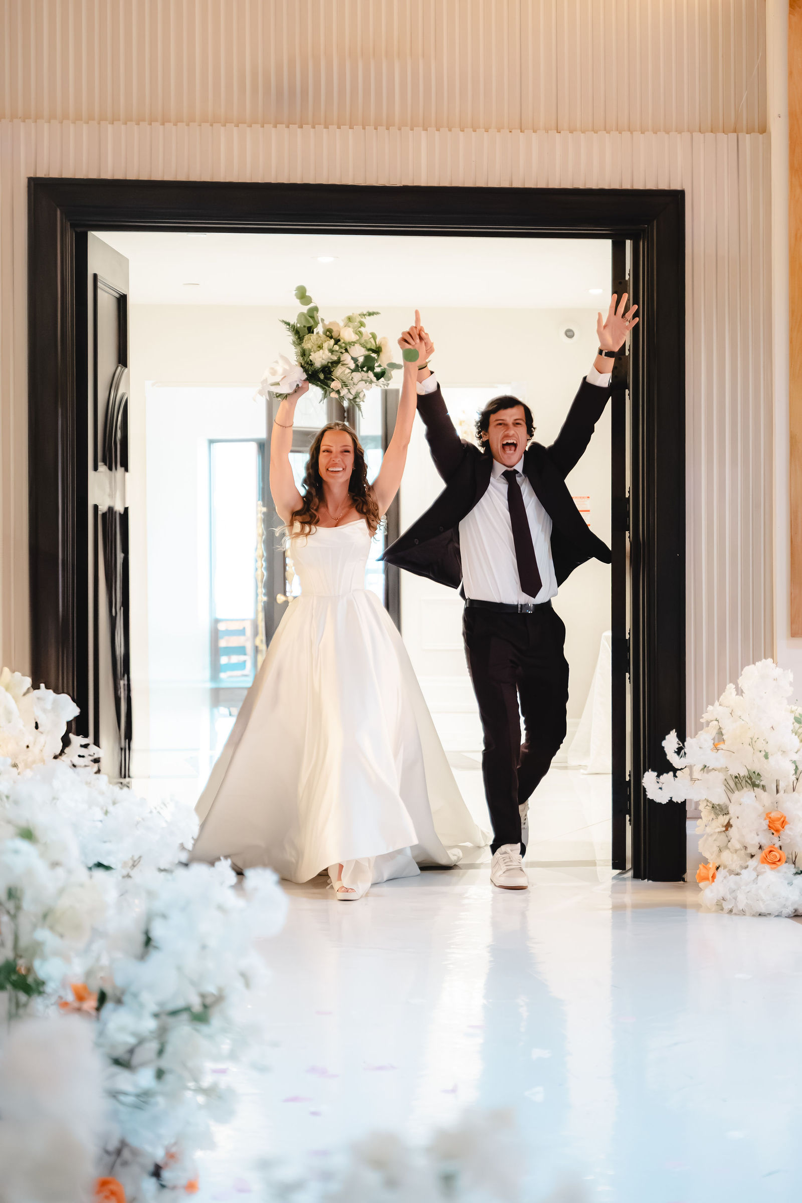 Triumphant grand entrance, arms raised