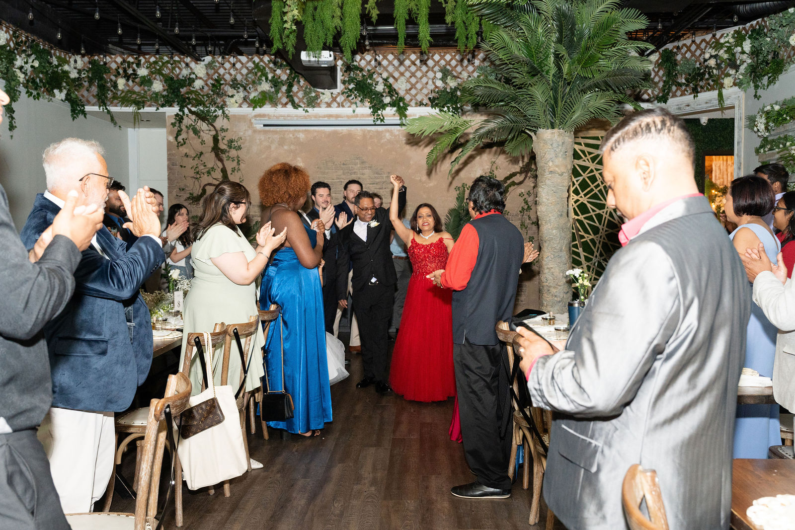 Grand entrance, arms raised high