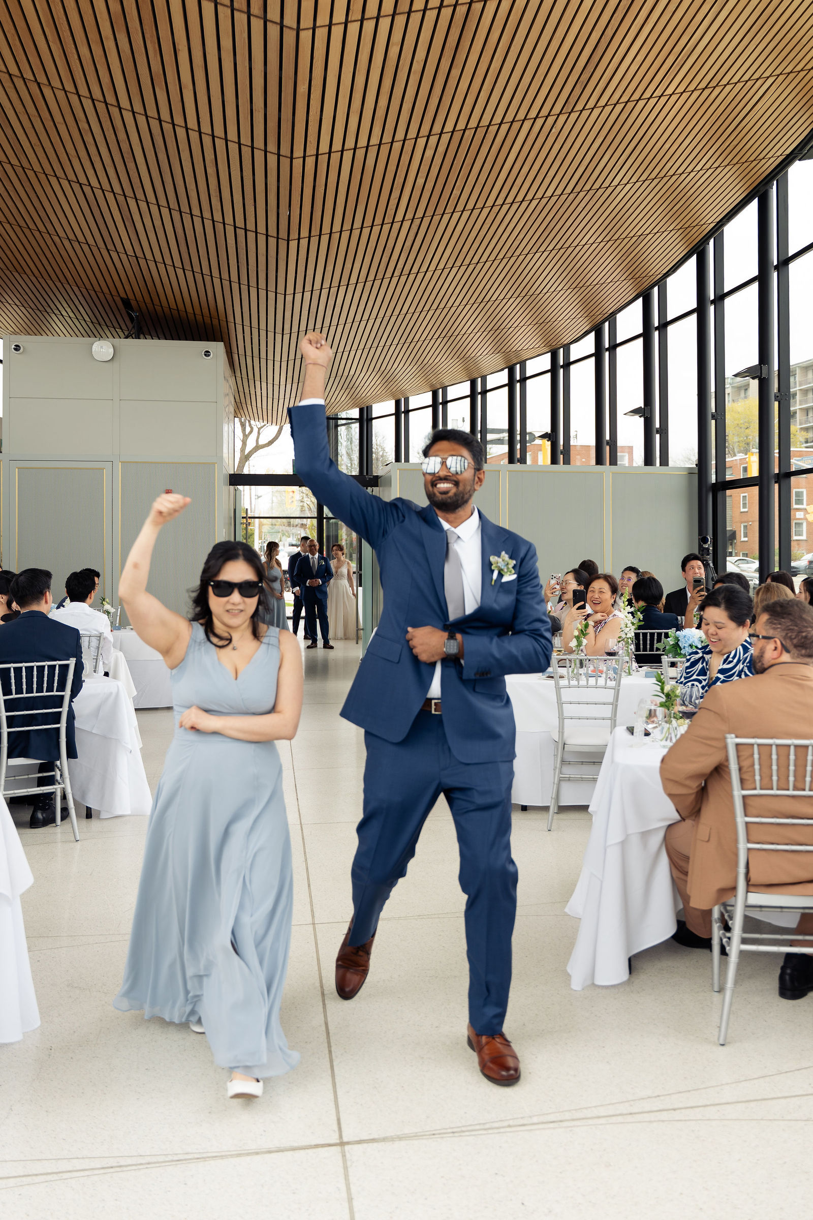 Joyful grand entrance, fists in air