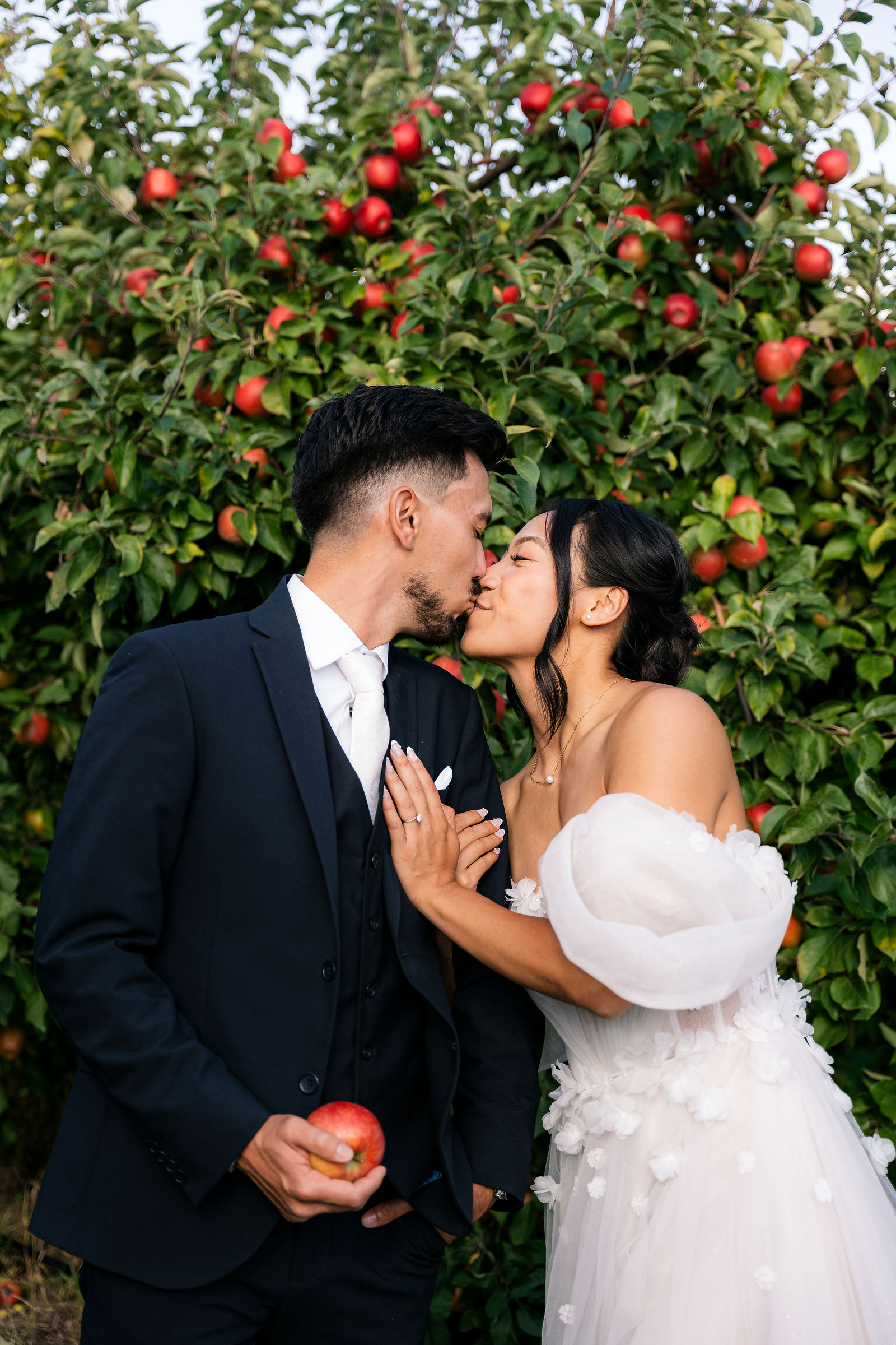 A stolen kiss in the apple orchard