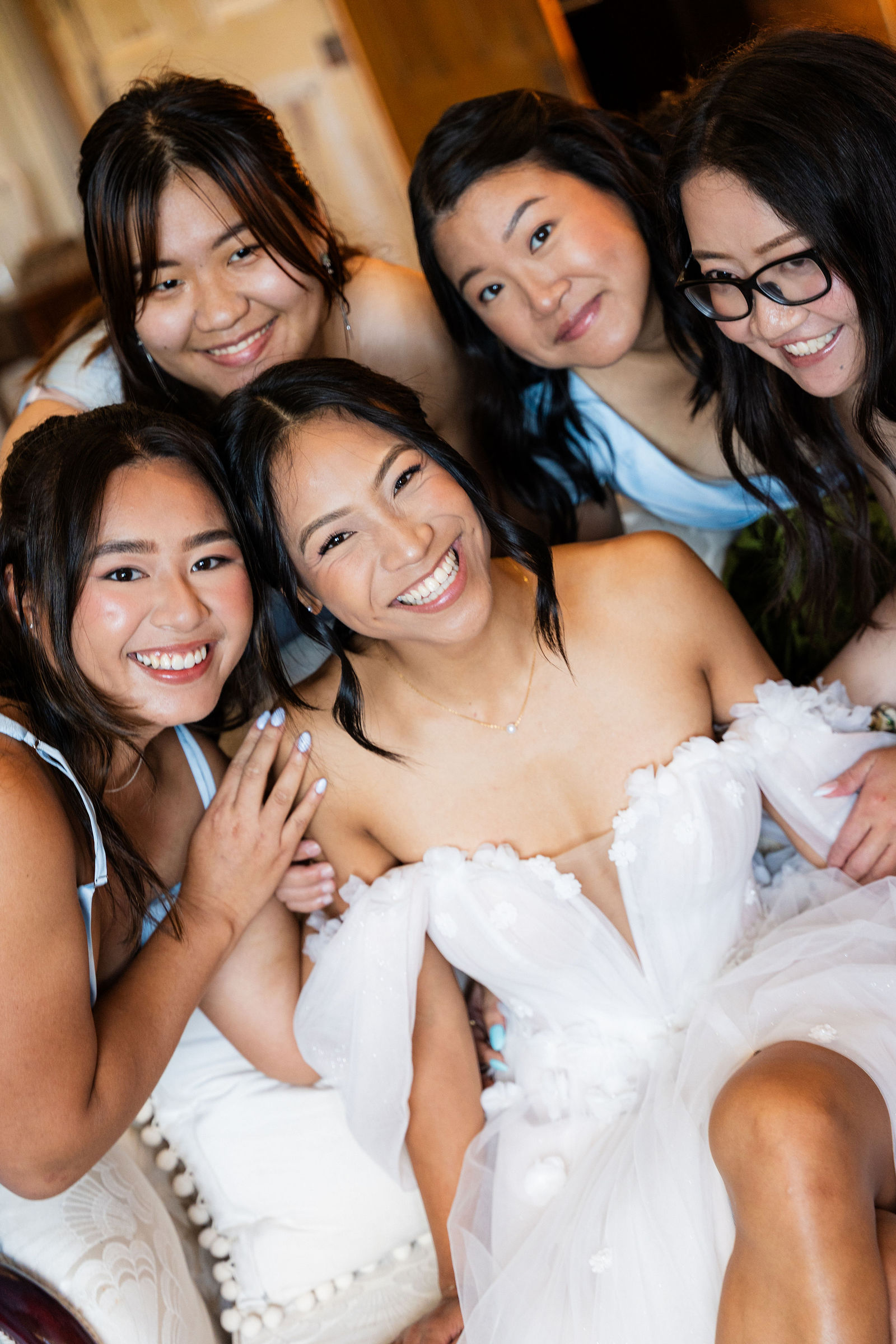 Bridesmaids gathered close and glowing