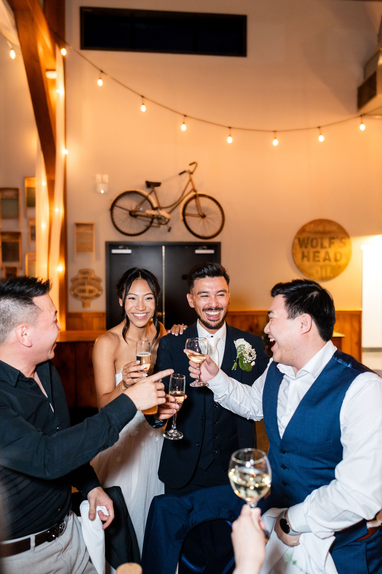 Both laughing through a champagne toast